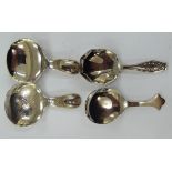 Four early 20thC silver caddy spoons, viz.