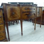 A modern reproduction of a George III string inlaid mahogany sideboard with two central drawers,