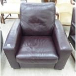 A modern stitched brown hide upholstered reclining armchair,