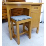 A mid 20thC child's beech framed single pedestal desk,