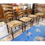 A set of four beech framed ladder back dining chairs,