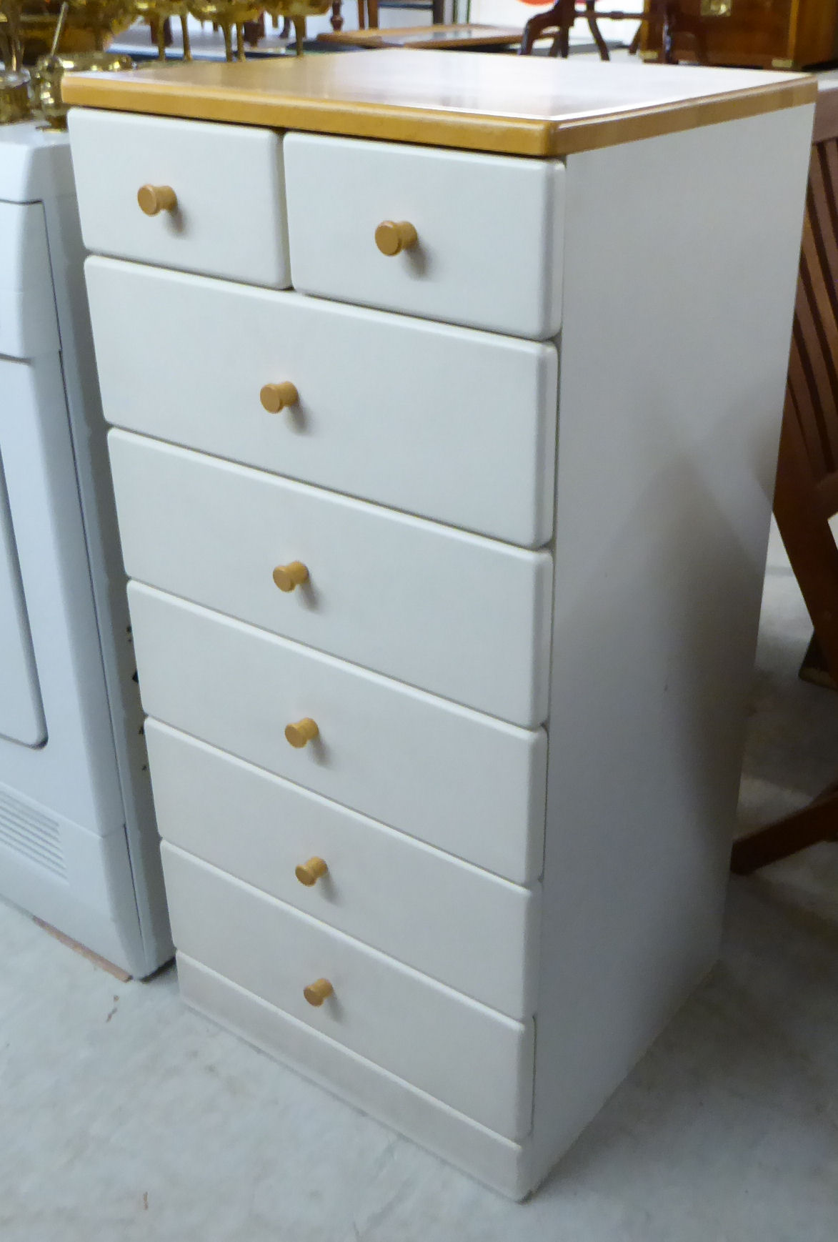 A modern white painted beech pedestal chest with two short/five long drawers,