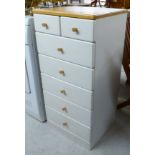 A modern white painted beech pedestal chest with two short/five long drawers,