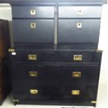 A modern black ash four drawer dressing chest with applied brass mounts,