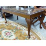 A reproduction of a Georgian style burr walnut finished coffee table,