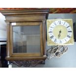A late 18thC and later oak cased hanging clock hood with scrolled ornament,