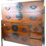 Two similar mid 20thC Orientally inspired stained pine chests with applied iron mounts 19''h