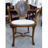 An early 20thC North Italian inspired satin mahogany framed salon chair,