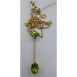 A 9ct gold fine wire link necklace, the bar pendant set with two peridots,
