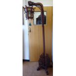 A 1920/30s Chinese rosewood lamp standard with a carved dragon's head terminal (suspending a later