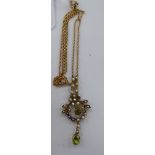 A 9ct gold peridot and seed pearl set pendant, on a fine neckchain,