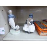 Two Royal Copenhagen porcelain figures, viz. a seated child doing needlework No.