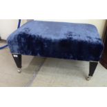 A Greengate crushed blue velvet upholstered stool, raised on square,