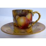 A Royal Worcester bone china coffee can and a matched saucer, decorated with soft fruit and gilding,