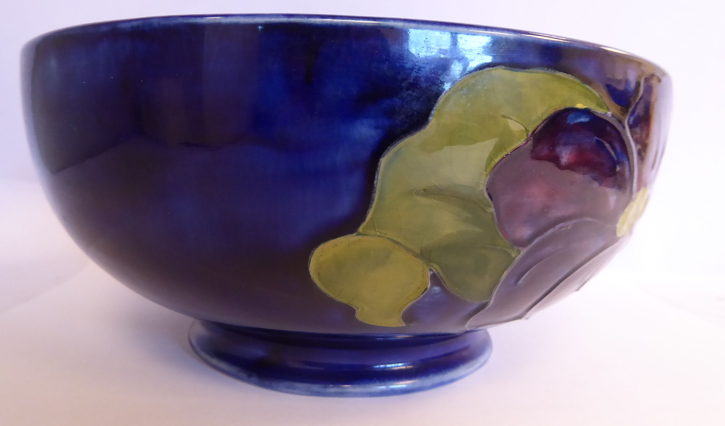 A Moorcroft pottery footed fruit bowl, decorated in tubeline in a version of the Anemone design, - Image 3 of 8