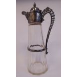 A late 19thC facet cut glass claret jug of tapered form with a decoratively engraved and cast