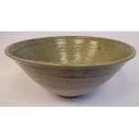 A pale green glazed studio pottery footed bowl,