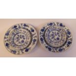 A pair of early 20thC Meissen porcelain dishes with raised, wide borders,