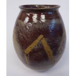 An N Braden two tone brown glazed studio pottery vase of ovoid form,