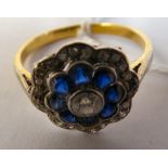 An 18ct bi-coloured gold diamond and sapphire cluster ring