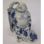 A late 19thC Chinese blue and white decorated porcelain figure, a standing,