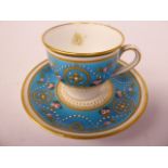 A Minton's china cabinet cup and saucer, decorated with rose sprigs and gilded designs,