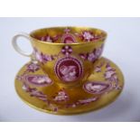 A Coalport gilded china cabinet cup and saucer,