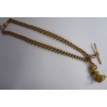 A 9ct gold curb link double Albert with one dog clip and a yellow metal,