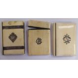 Two similar late Victorian ivory clad card cases of book design,