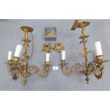 A pair of early 20thC French triple branch, gilt metal chandeliers,