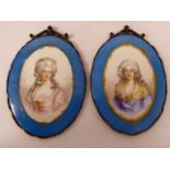 A pair of Continental painted porcelain oval plaques,