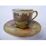 A Royal Doulton gilded china cabinet cup and saucer,