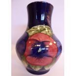 A Moorcroft pottery vase of bulbous form with a wide, upstand neck,