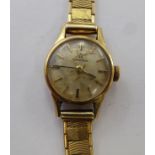 A lady's Omega 9ct gold cased wristwatch, faced by a baton dial,