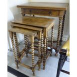 A 1920s oak card table, the rotating,