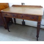 A William IV mahogany two drawer side table, raised on tapered,