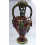 A late 19thC Palissy ware puzzle jug of waisted, ovoid form having twin,