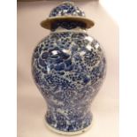 An early 19thC Chinese porcelain vase of waisted, baluster form, having a domed cover,