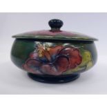 A Moorcroft pottery footed powder bowl of squat, bulbous form with a cover,