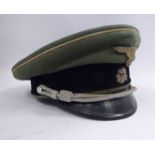 A German SS grey/black visor cap with a black band, white piping, silvered braid,