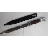 A German World War II bayonet, the stainless steel handle with a two part hardwood grip,