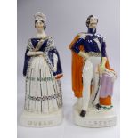 A pair of mid 19thC Staffordshire pottery figures, Queen Victoria and Prince Albert,