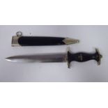 A German SS dagger, the ebonised handle with emblems,