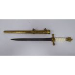A German naval dagger with a brass handle and moulded grip, eagle,