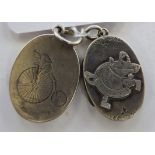 Two early 20thC silver pendant lockets of oval form mixed marks 11