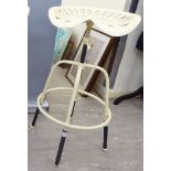 A modern cream painted cast iron bar stool, the rotating height adjustable,