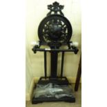 A modern reproduction of a Victorian cast iron stickstand,