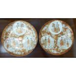 A pair of early 20thC Kutani porcelain chargers,