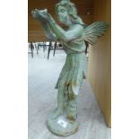 An 'antique' finished, green painted, cast iron model, a fairy,