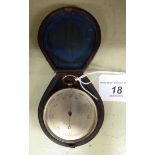 A late 19thC lacquered brass cased pocket barometer, faced by an engraved,